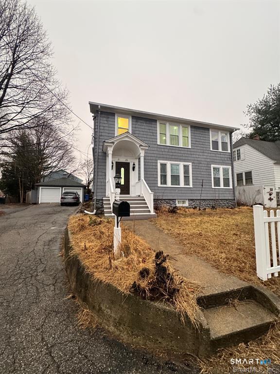 23 Lake Street Waterbury, CT 06708 - Photo 17 of 17 a front view of a house with yard patio and fire pit