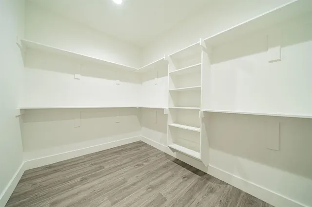 a view of an empty walk in closet