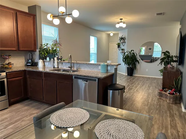 a kitchen with a table and chairs in it