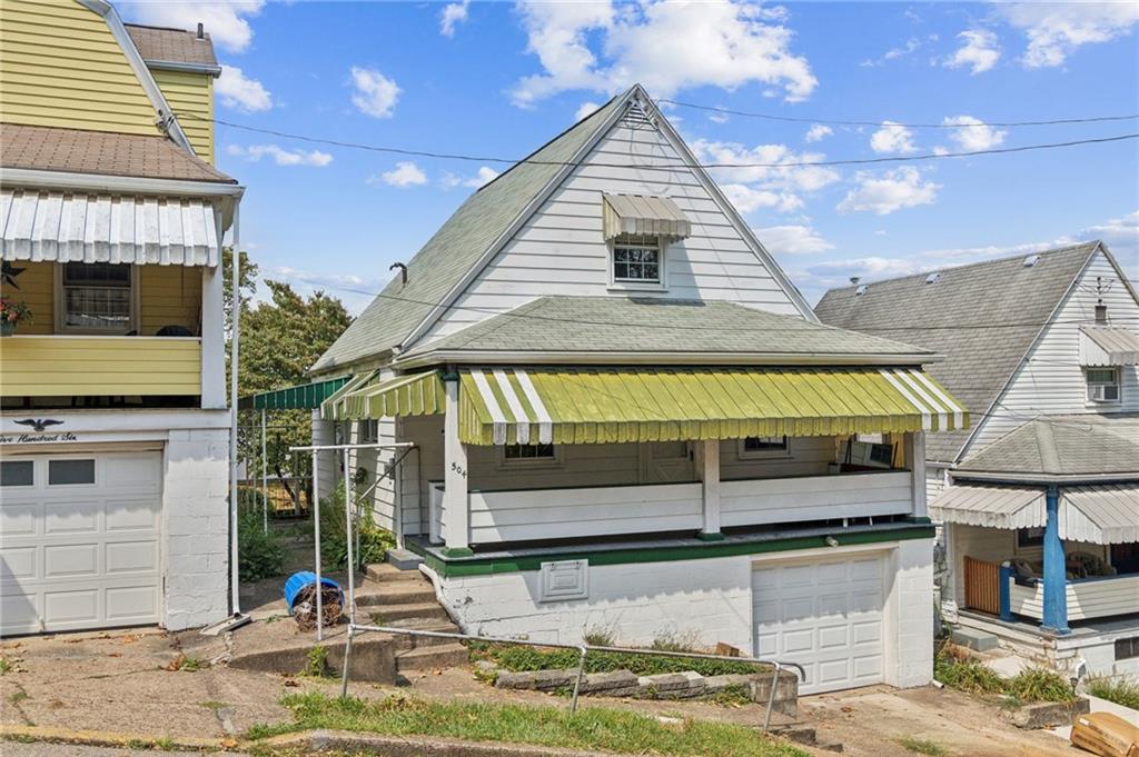 a view of a house with entrance gate