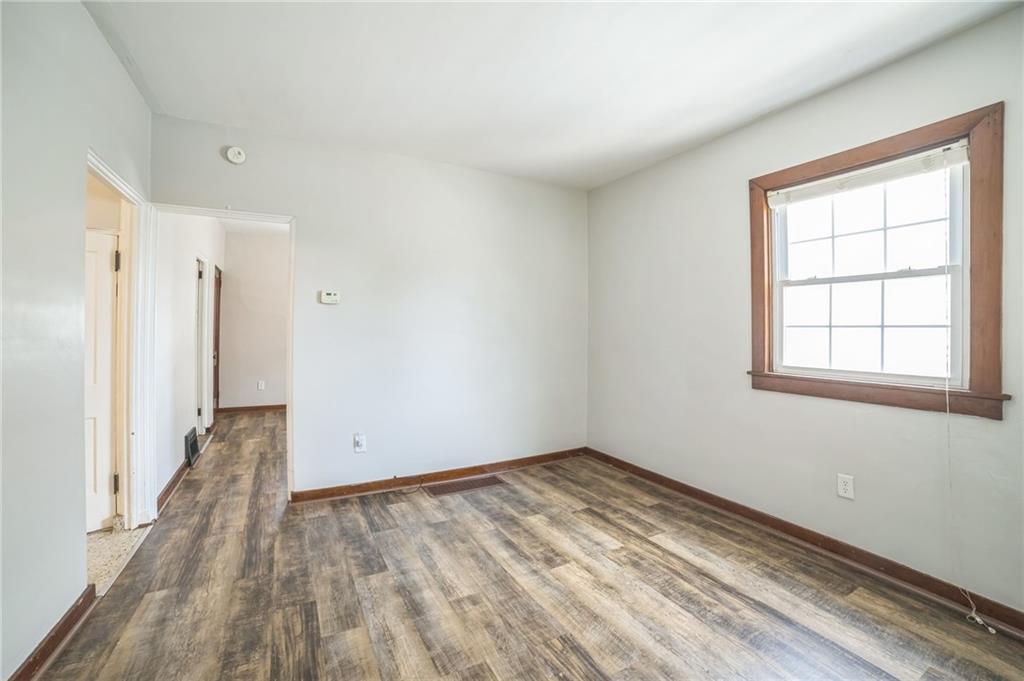 504 1st Street Charleroi, PA 15022 - Photo 13 of 18 wooden floor in an empty room with a window
