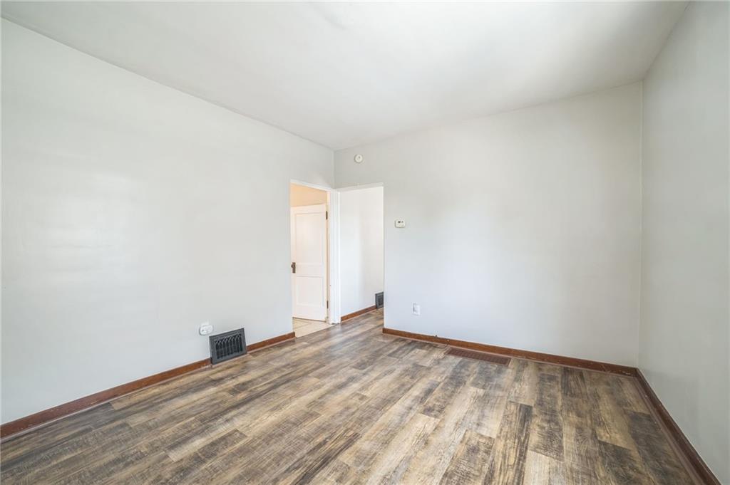 504 1st Street Charleroi, PA 15022 - Photo 15 of 18 an empty room with wooden floor