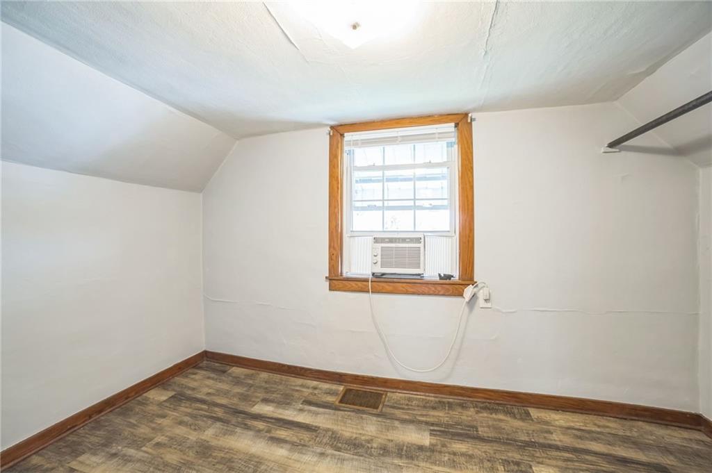 504 1st Street Charleroi, PA 15022 - Photo 7 of 18 an empty room with wooden floor and windows