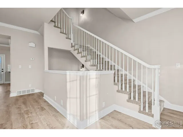 a view of entryway with wooden floor