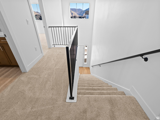 18 South Crimson Way, Unit 304 Mapleton, UT 84664 - Photo 11 of 17 Stairs with carpet floors and baseboards
