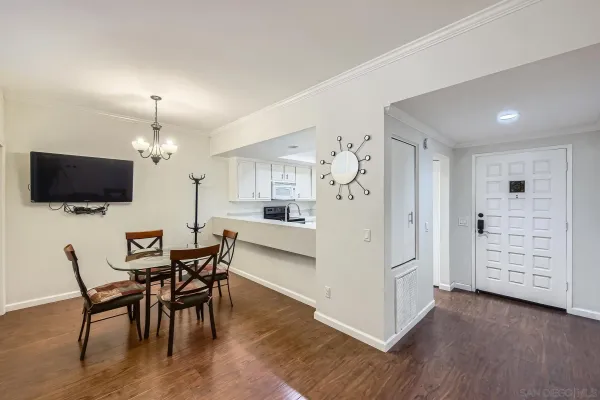a view of a dining room with furniture and wooden floor