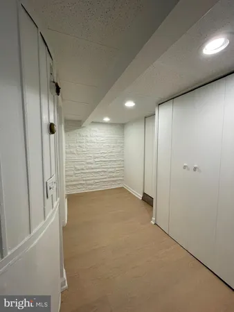 a kitchen with cabinets and white appliances
