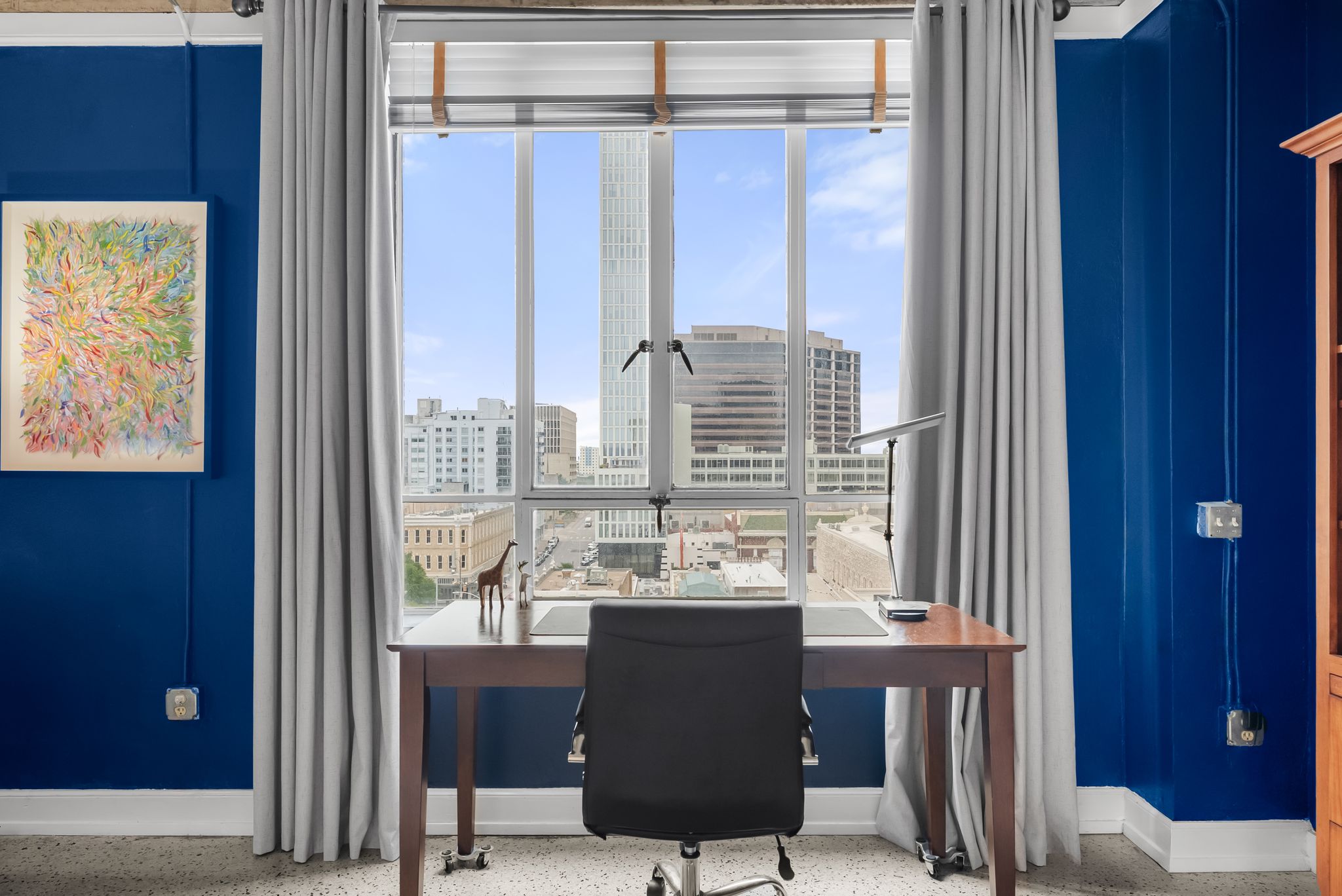 710 Colorado Street, Unit 6E Austin, TX 78701 - Photo 10 of 24 A spacious home office with a city view, perfect for productivity.