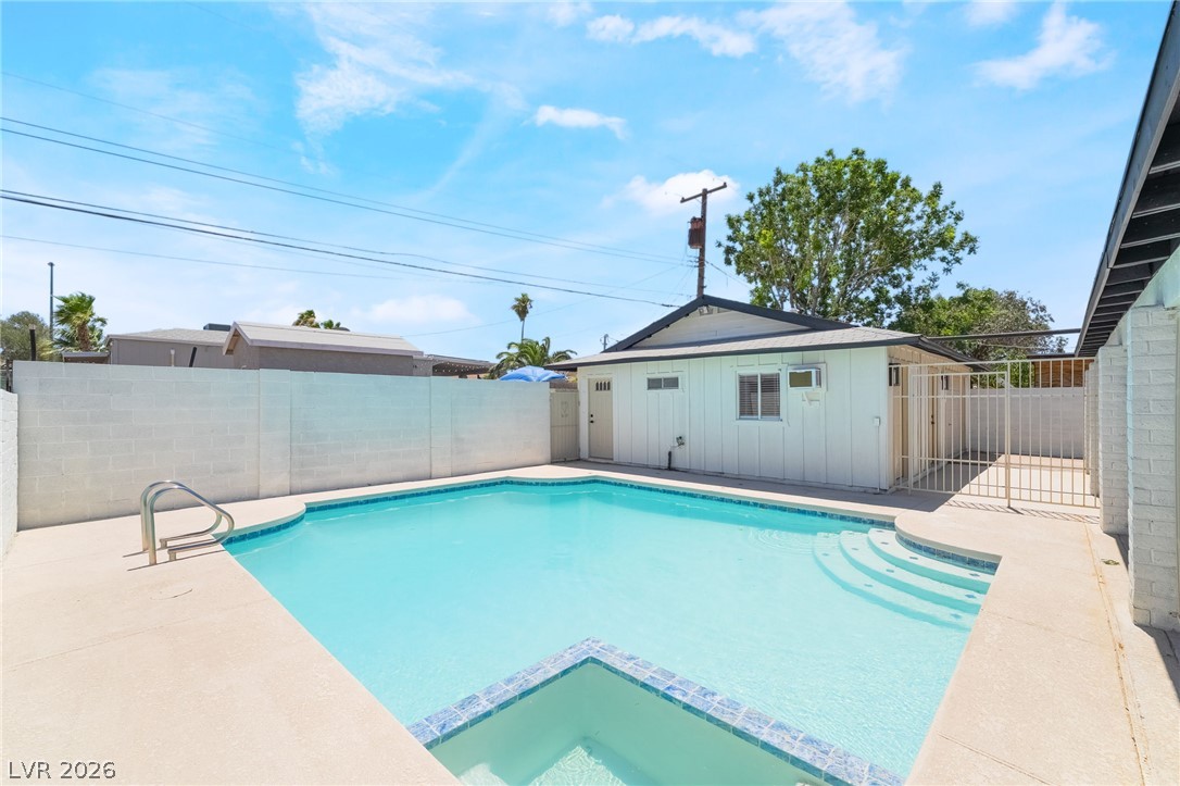 39 Lowery Street Henderson, NV 89015 - Photo 38 of 40 A private, in-ground swimming pool offers refreshing relaxation on sun-drenched days.