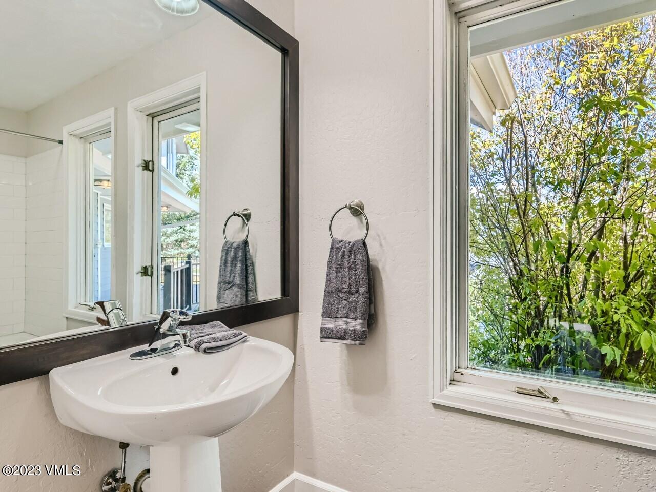 25 Snow Owl Eagle, CO 81631 - Photo 14 of 37 a bathroom with a sink and a mirror