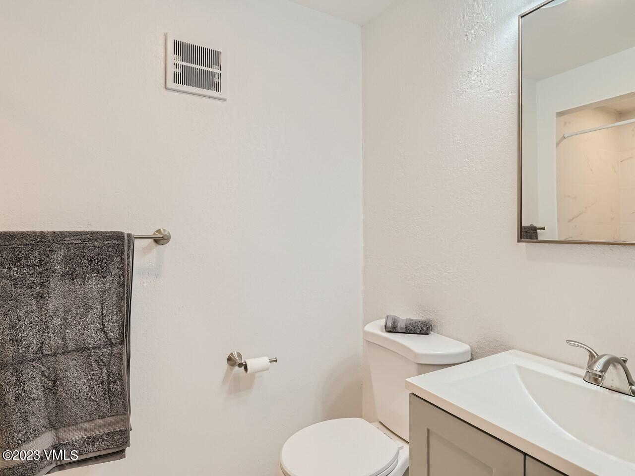 25 Snow Owl Eagle, CO 81631 - Photo 19 of 37 a bathroom with a toilet sink and mirror