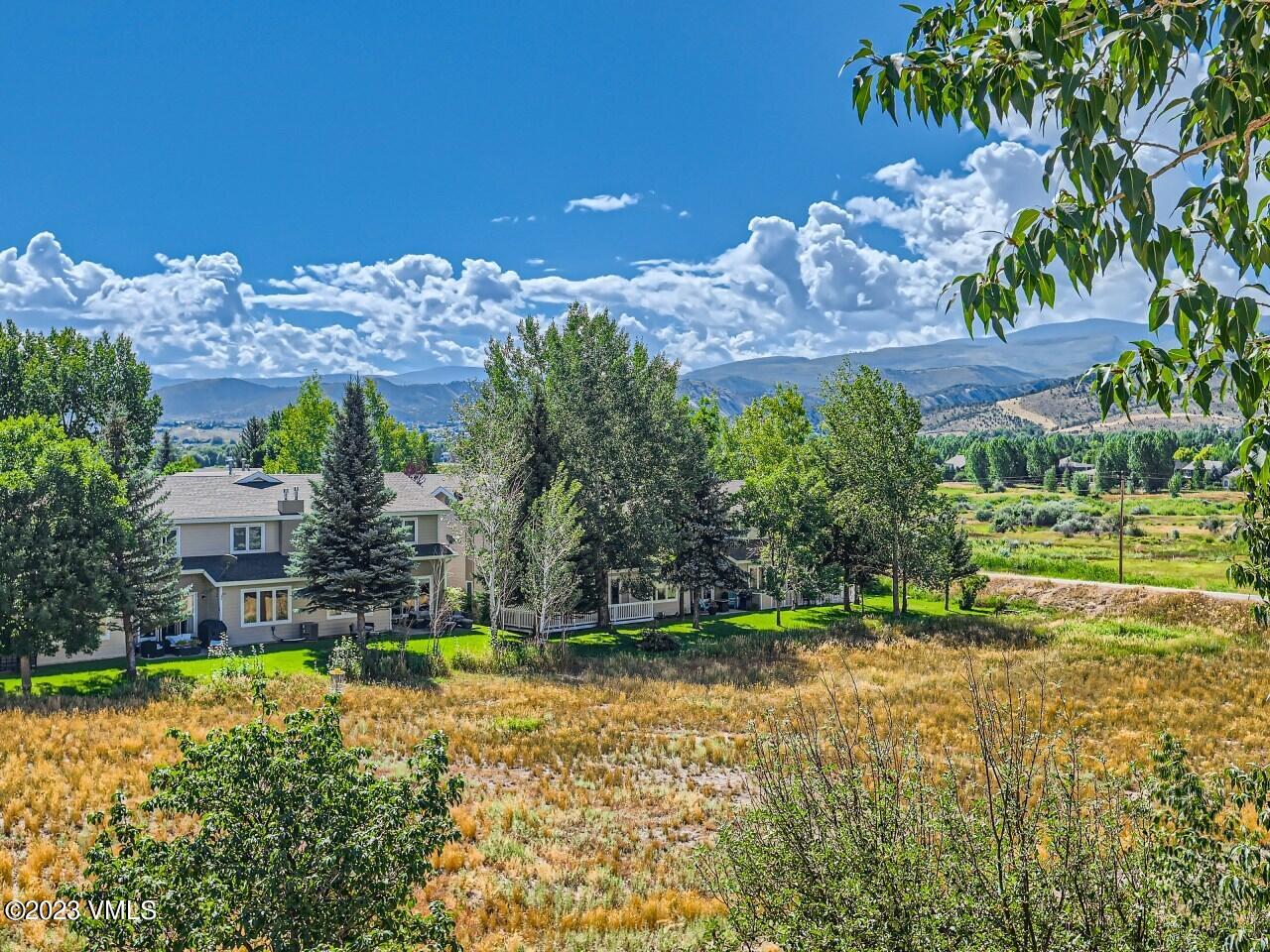 25 Snow Owl Eagle, CO 81631 - Photo 27 of 37 a view of a house with a yard and a large pool