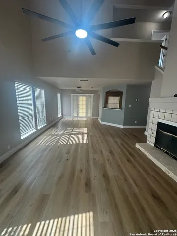 a view of an empty room and fire place