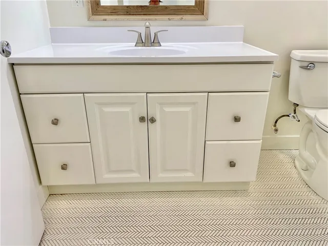 a stove top oven sitting inside of a kitchen