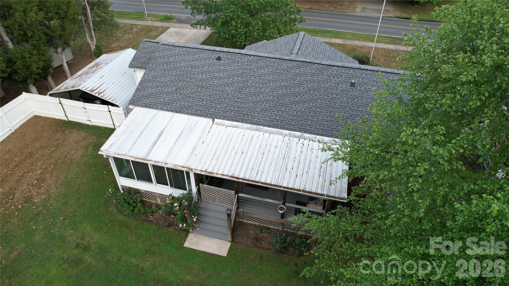 204 Clinton Avenue Clover, SC 29710 - Photo 25 of 26 a view of a white house with a yard