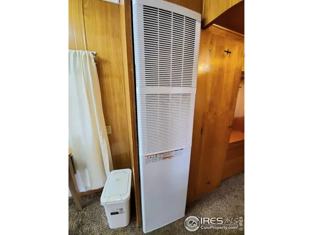 a bathroom with a granite countertop shower and a toilet