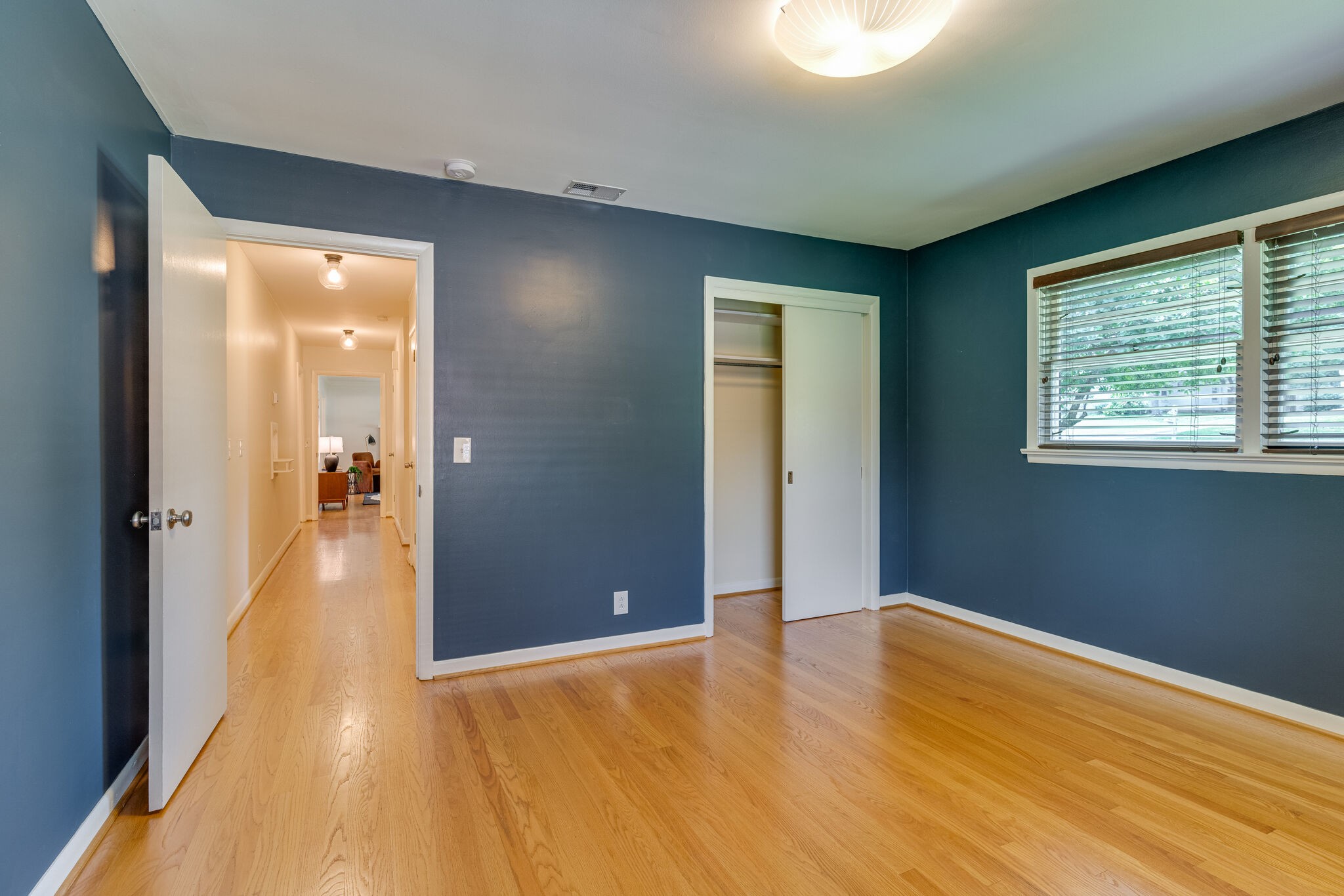 3512 Pleasant Valley Road Nashville, TN 37204 - Photo 17 of 40 a view of a hallway with wooden floor and a bathroom