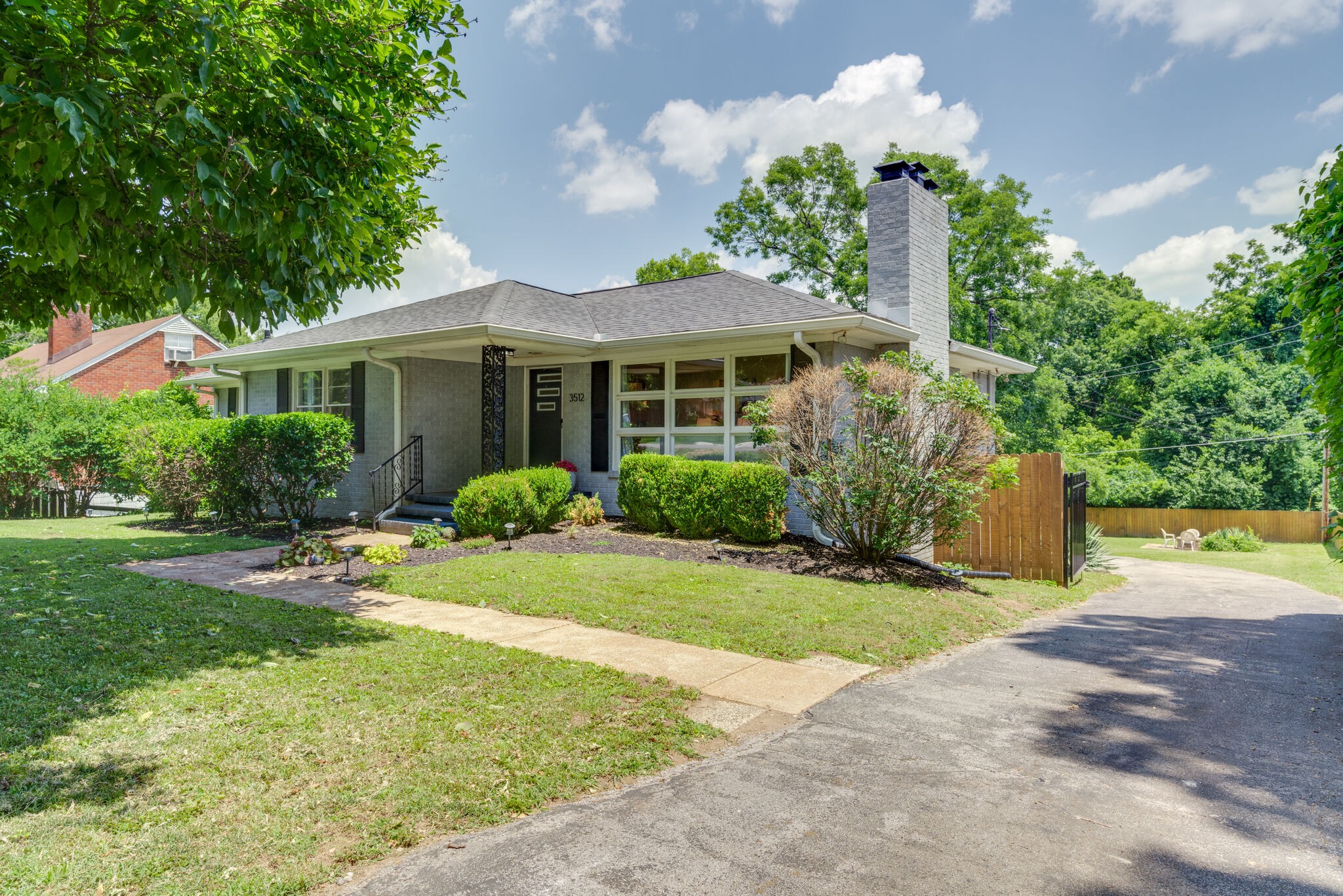 3512 Pleasant Valley Road Nashville, TN 37204 - Photo 2 of 40 a front view of a house with garden