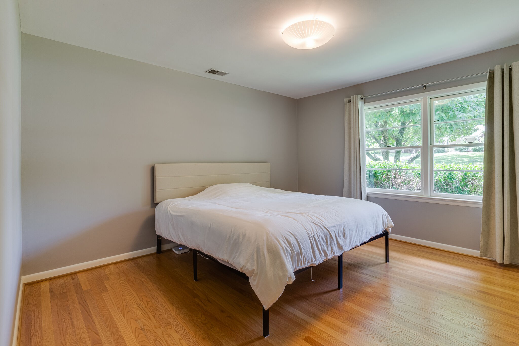 3512 Pleasant Valley Road Nashville, TN 37204 - Photo 24 of 40 a large bed sitting in a bedroom next to a window