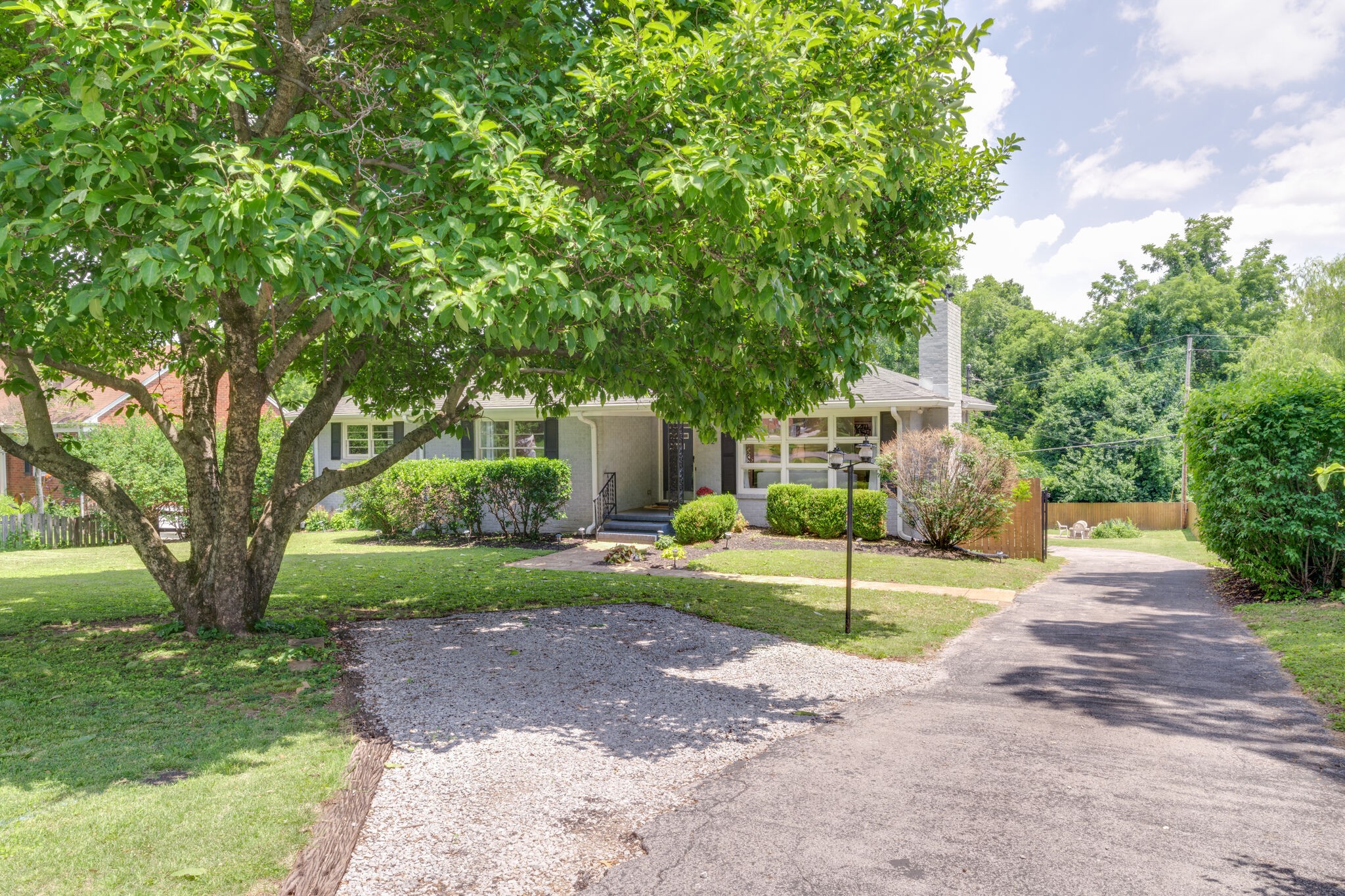 3512 Pleasant Valley Road Nashville, TN 37204 - Photo 3 of 40 a view of a house with a yard and large tree