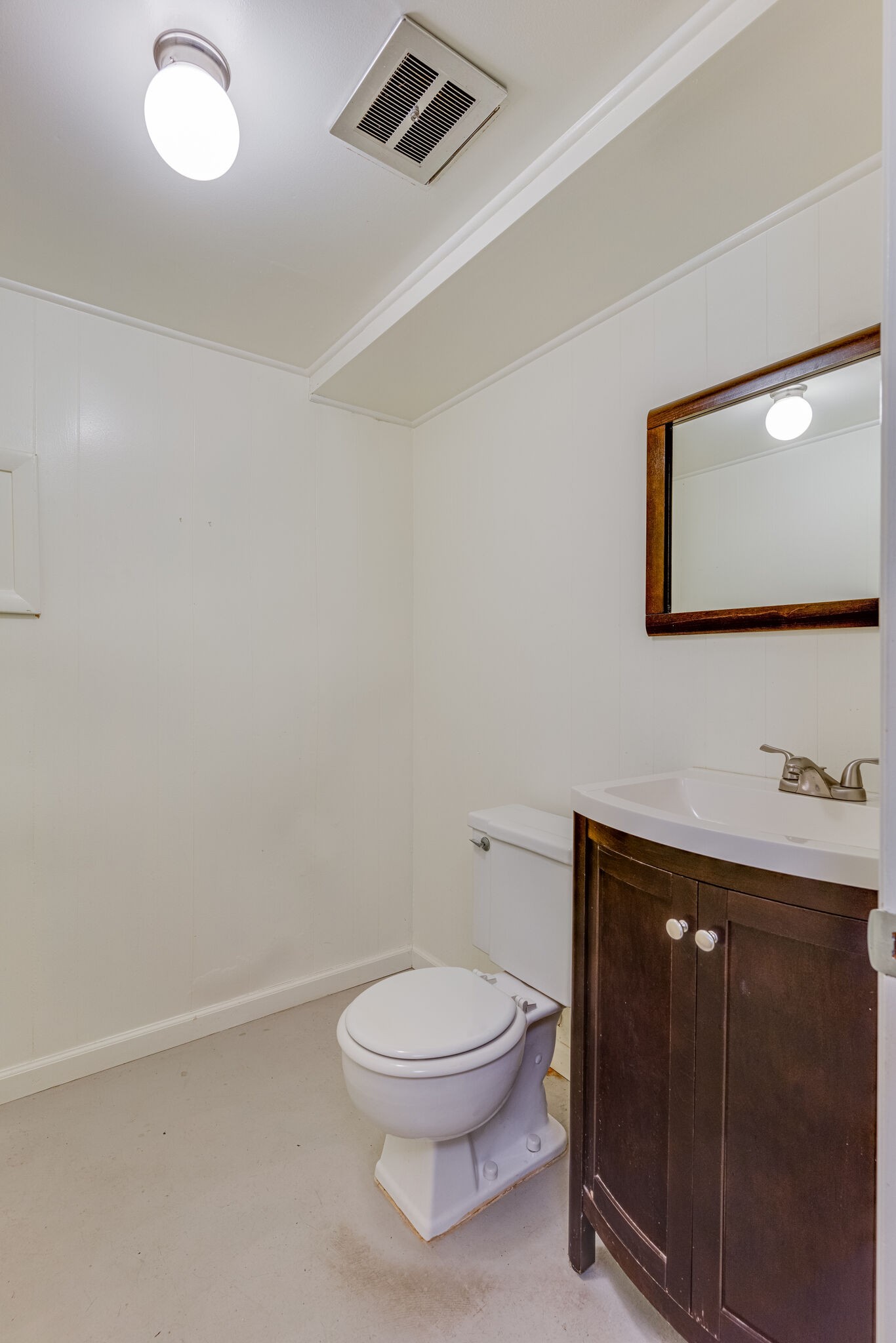 3512 Pleasant Valley Road Nashville, TN 37204 - Photo 32 of 40 a bathroom with a toilet a sink and mirror