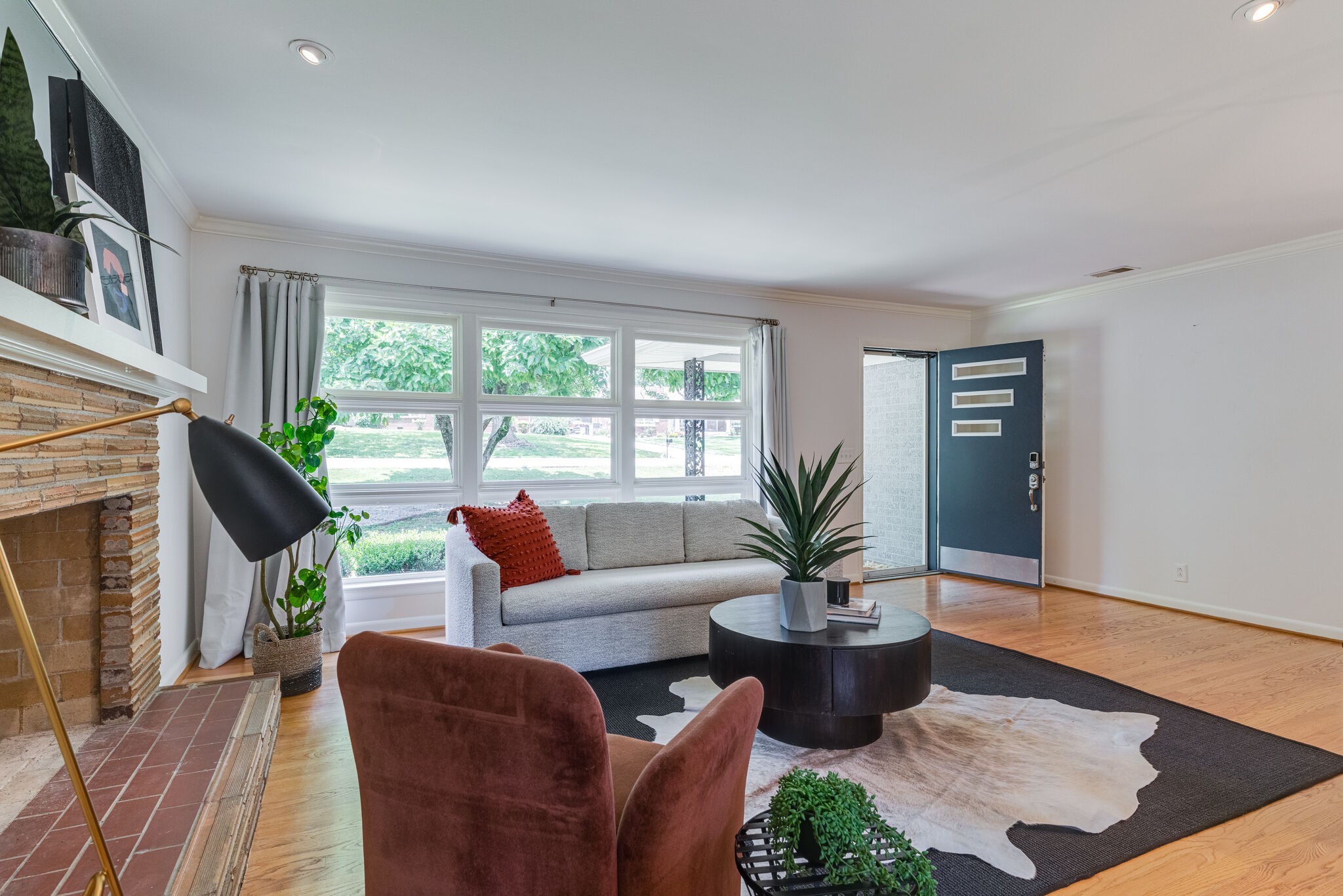 3512 Pleasant Valley Road Nashville, TN 37204 - Photo 6 of 40 a living room with furniture a fireplace and a potted plant