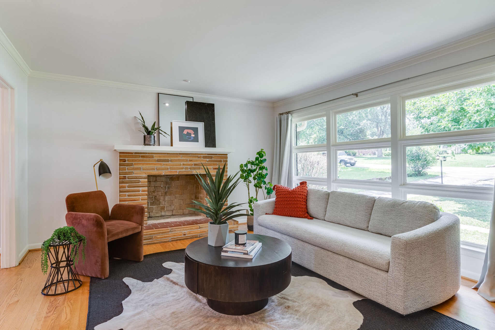 3512 Pleasant Valley Road Nashville, TN 37204 - Photo 7 of 40 a living room with furniture a fireplace and a large window