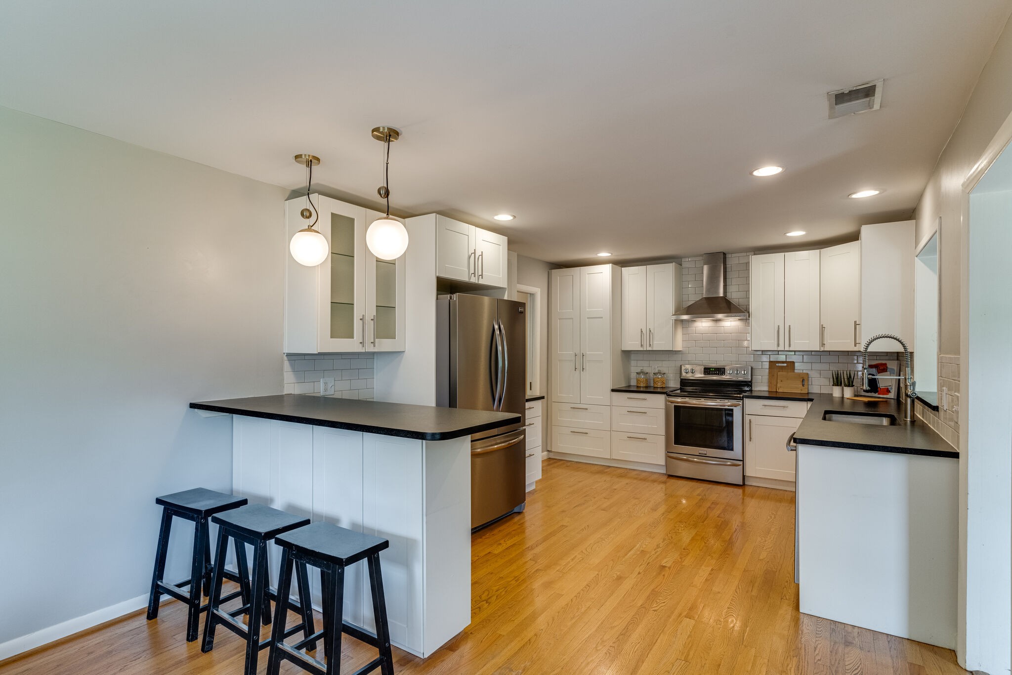 3512 Pleasant Valley Road Nashville, TN 37204 - Photo 10 of 40 a kitchen with granite countertop a stove and chairs