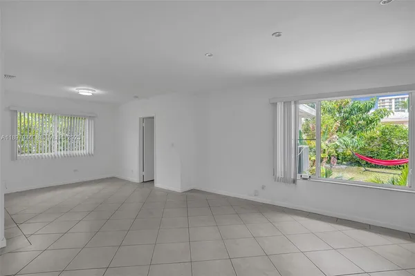 an empty room with windows and view