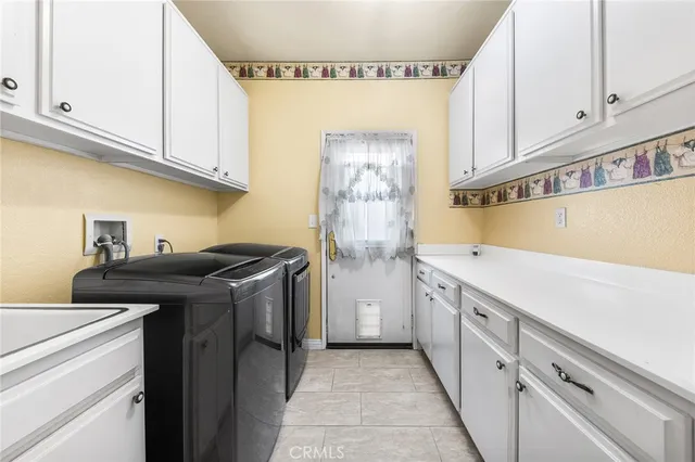 a kitchen with stainless steel appliances granite countertop a refrigerator and a stove