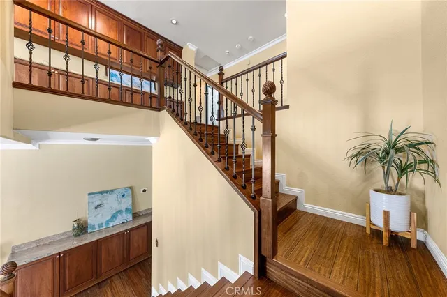a view of entryway and hall with wooden floor
