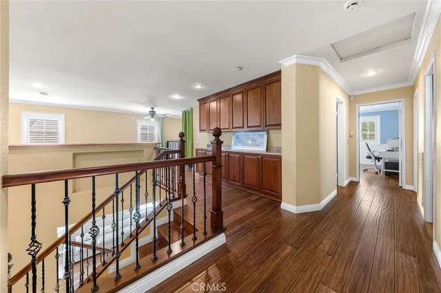 a view of a kitchen with wooden floor