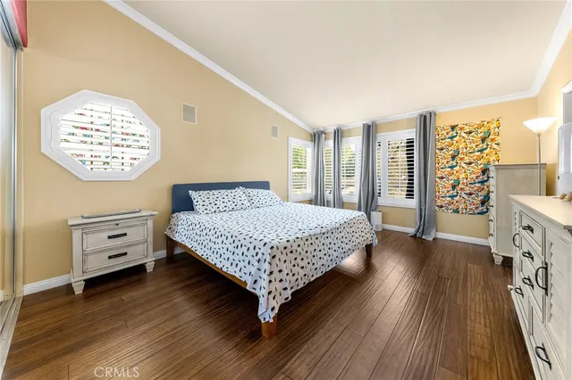 a bedroom with a bed and a table