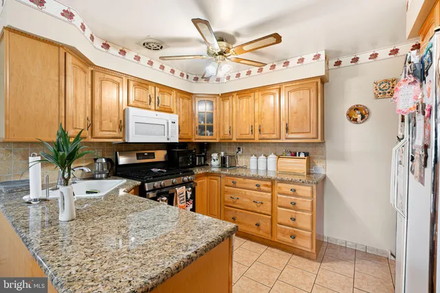 a kitchen with a refrigerator and a sink