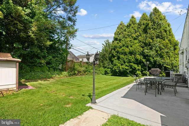 a view of a backyard with sitting area