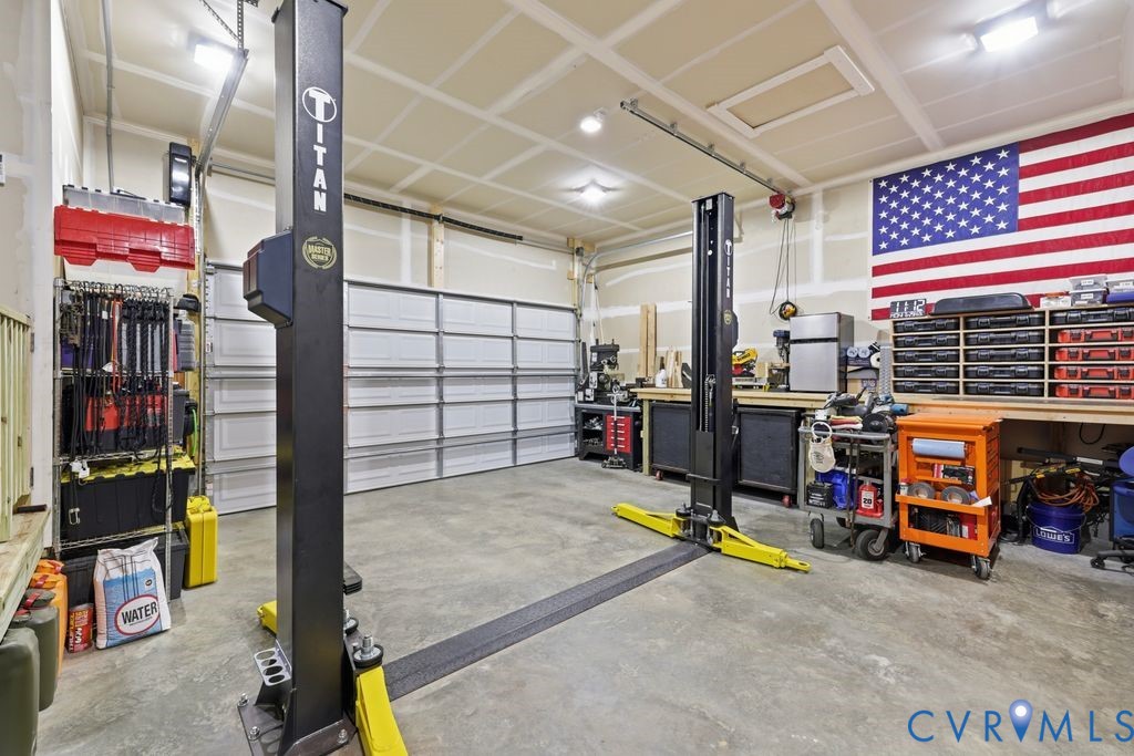 3259 Three Bridge Road Powhatan, VA 23139 - Photo 28 of 43 Spacious garage featuring a two-post vehicle lift,