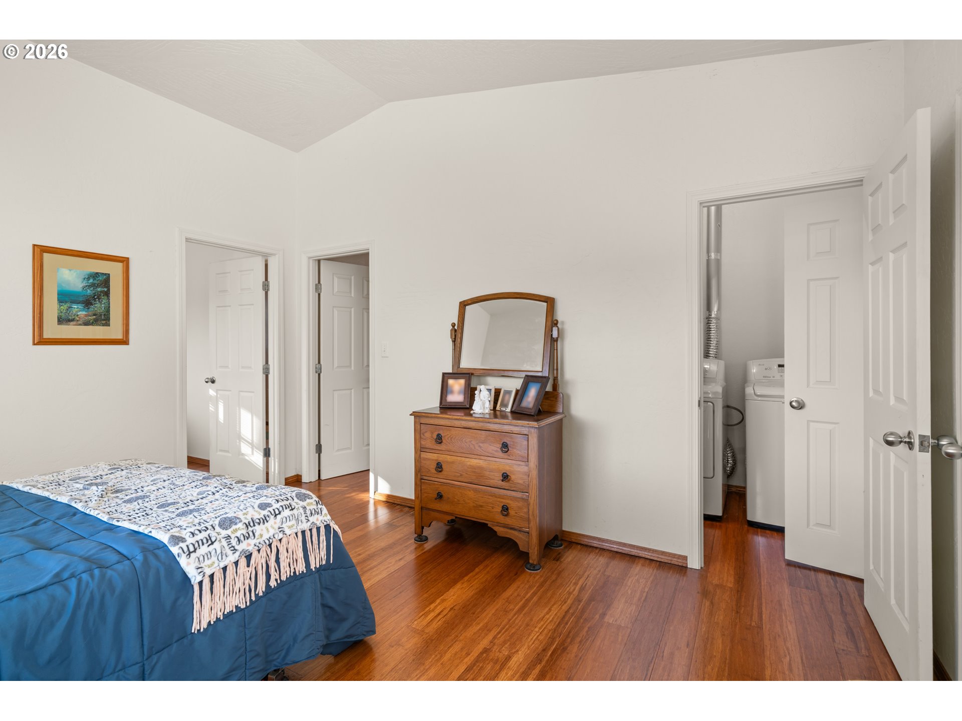 1115 Ransom Avenue Brookings, OR 97415 - Photo 11 of 32 a bedroom with a bed and a view of bathroom