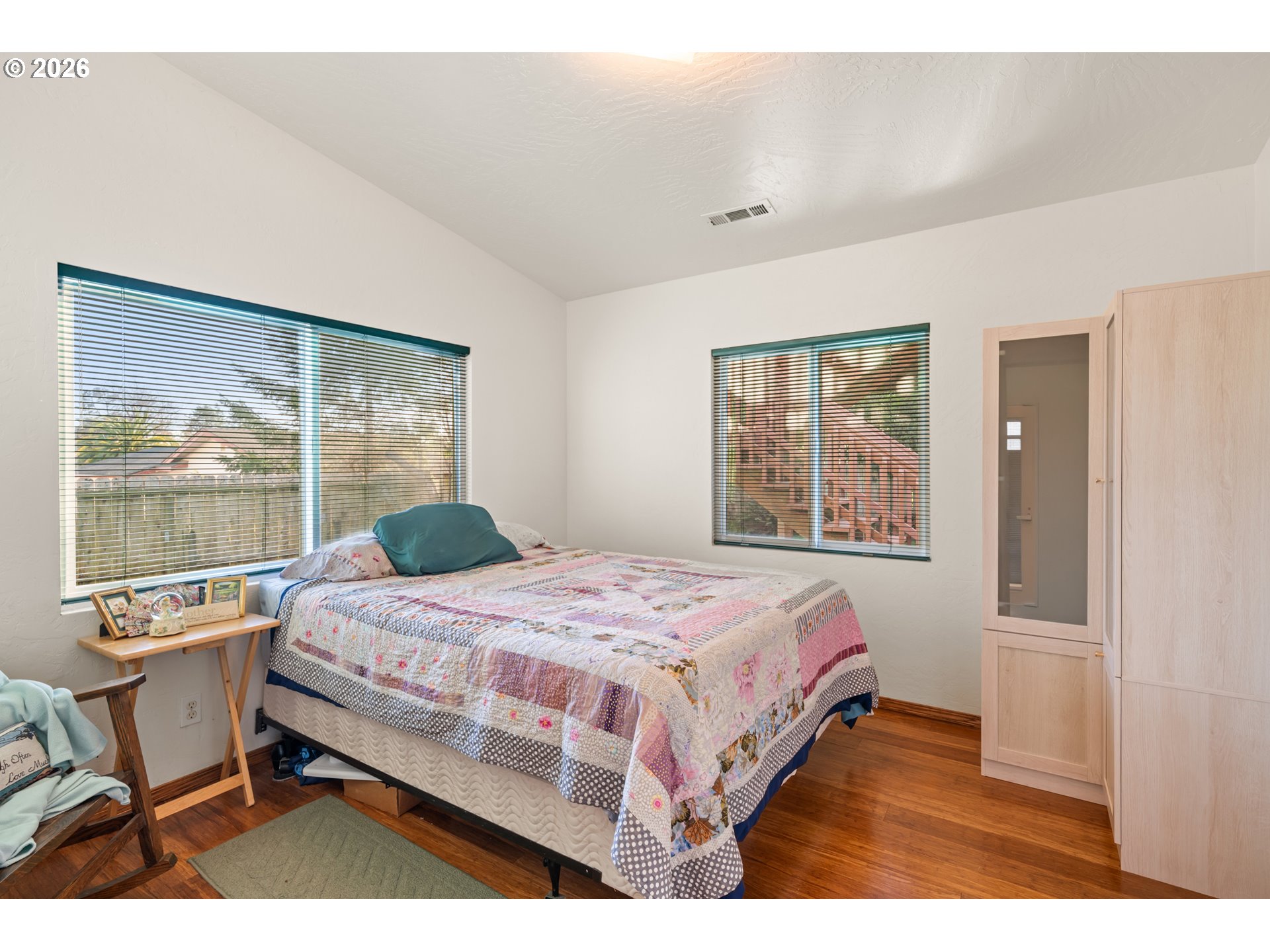 1115 Ransom Avenue Brookings, OR 97415 - Photo 14 of 32 a bedroom with a bed and a large window