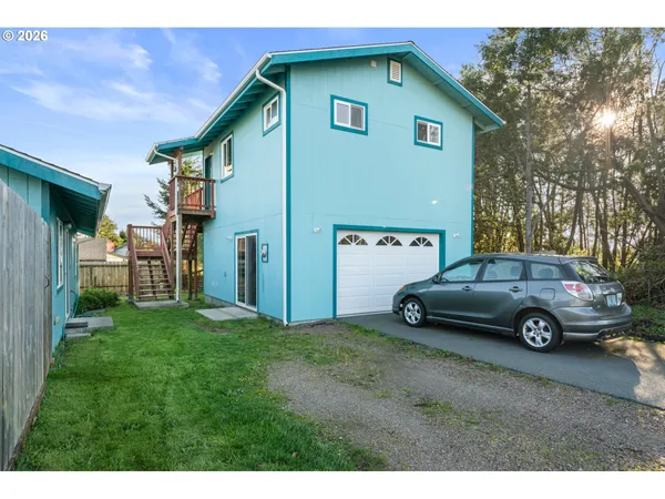 a view of a car parked in front of a house