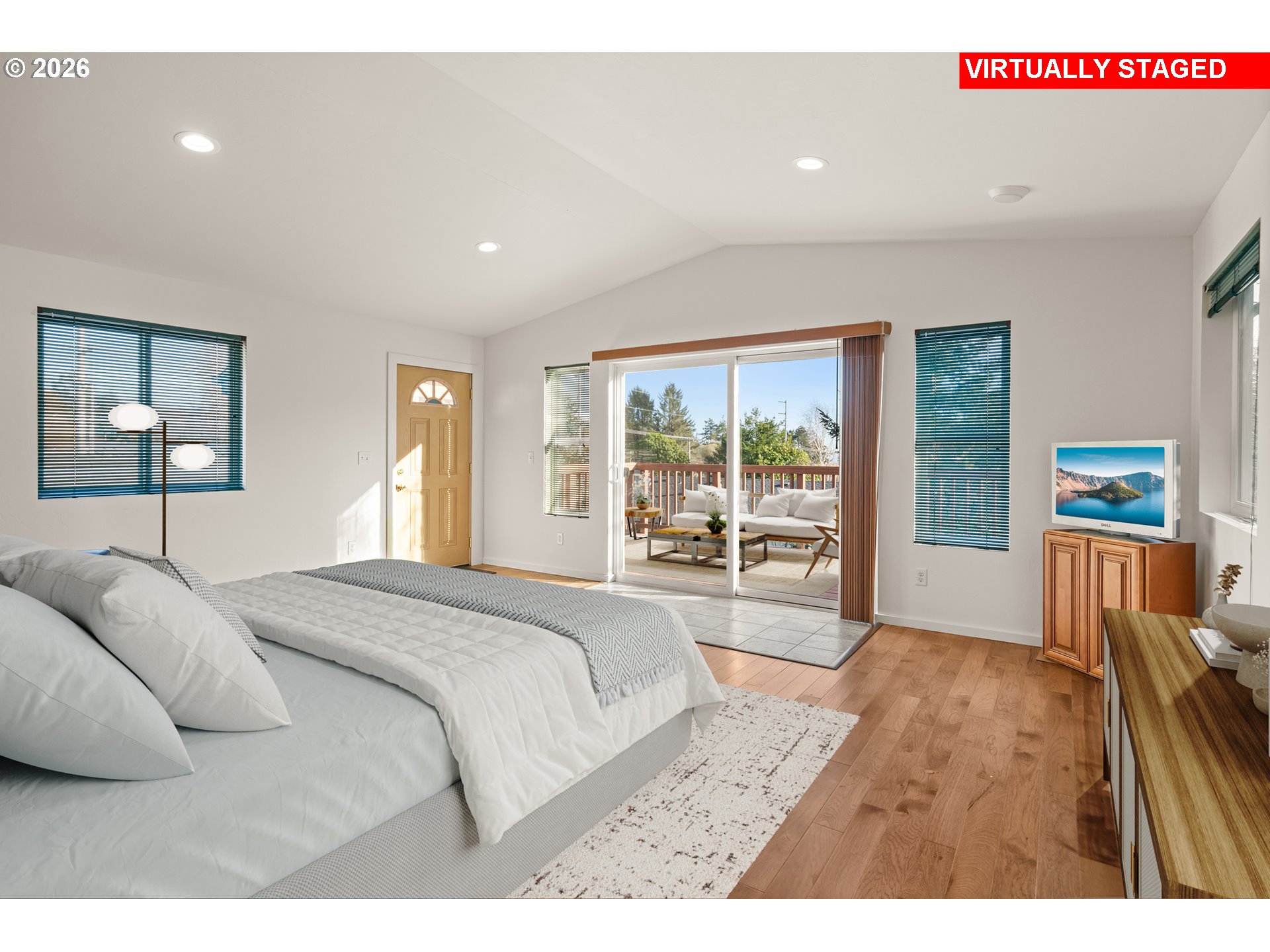 1115 Ransom Avenue Brookings, OR 97415 - Photo 19 of 32 a bedroom with a bed and wooden floor