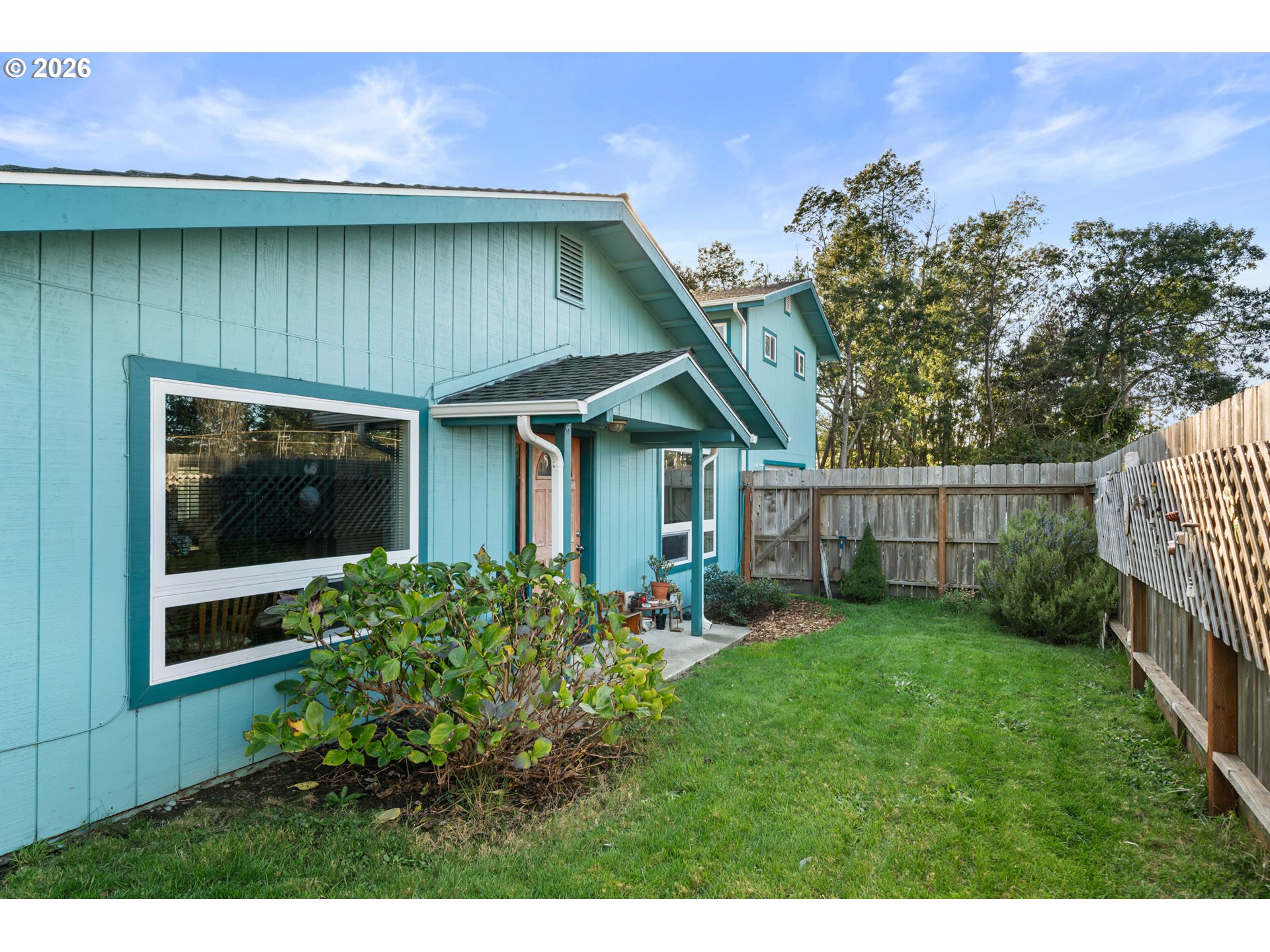 1115 Ransom Avenue Brookings, OR 97415 - Photo 2 of 32 a view of a house with a yard