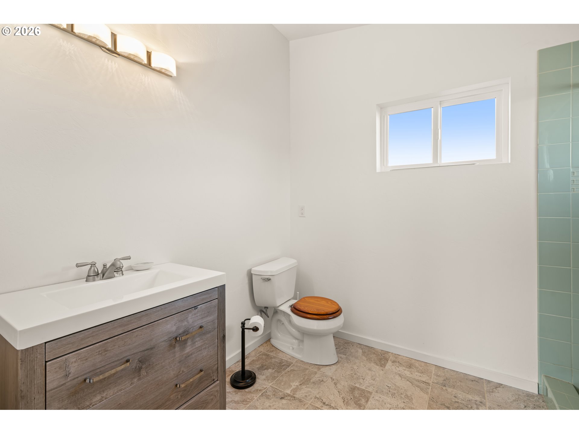 1115 Ransom Avenue Brookings, OR 97415 - Photo 21 of 32 a bathroom with a sink and a mirror