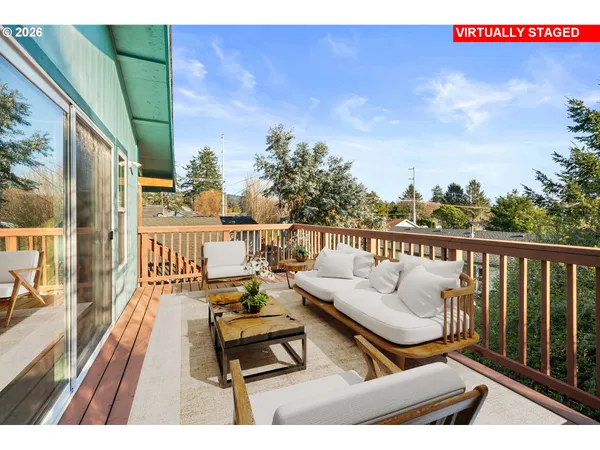 a terrace with outdoor seating and city view