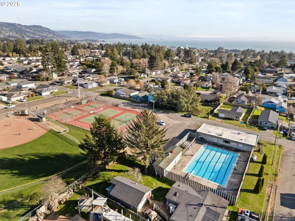an aerial view of residential houses with outdoor space