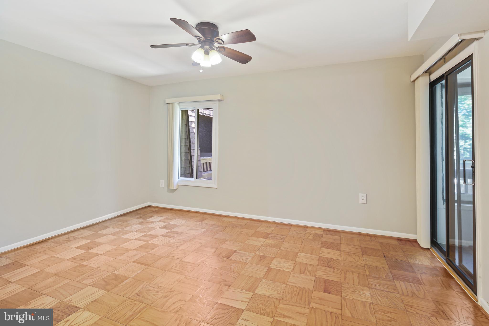 5239 West Running Brook Road, Unit 301 Columbia, MD 21044 - Photo 23 of 33 a view of an empty room with a window