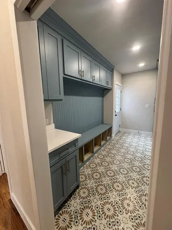 a kitchen with granite countertop a stove and cabinets