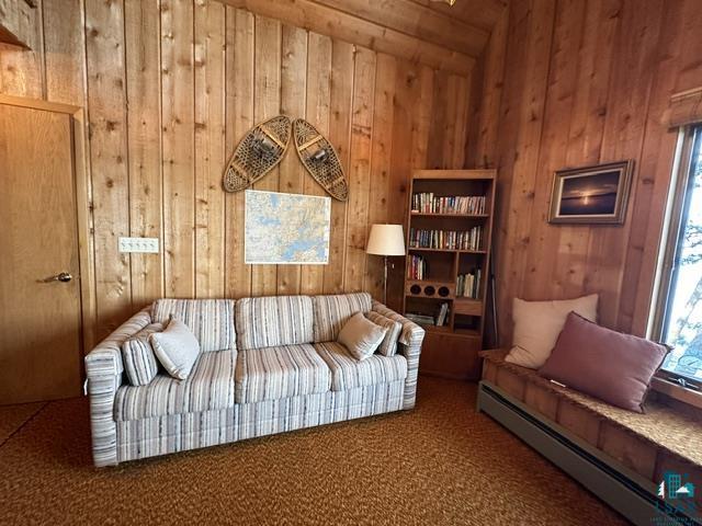 2763 Van Vac Road Ely, MN 55731 - Photo 6 of 37 Paneled walls with natural wood finish, built-in window seating, and a large window