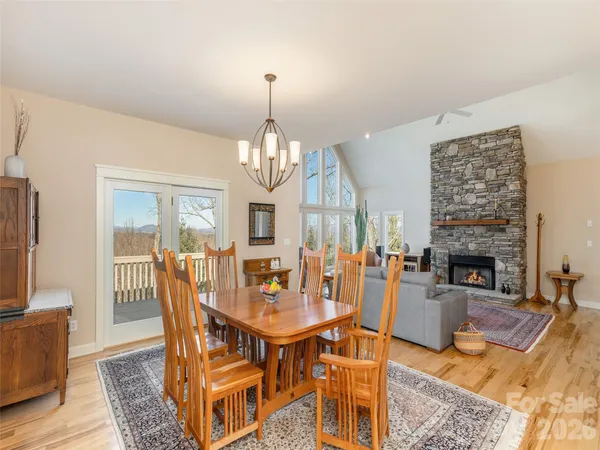 a view of a livingroom with furniture window and wooden floor