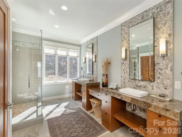 a spacious bathroom with sinks mirror and double