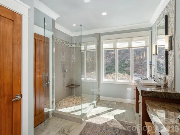 a bathroom with a tub shower and sink